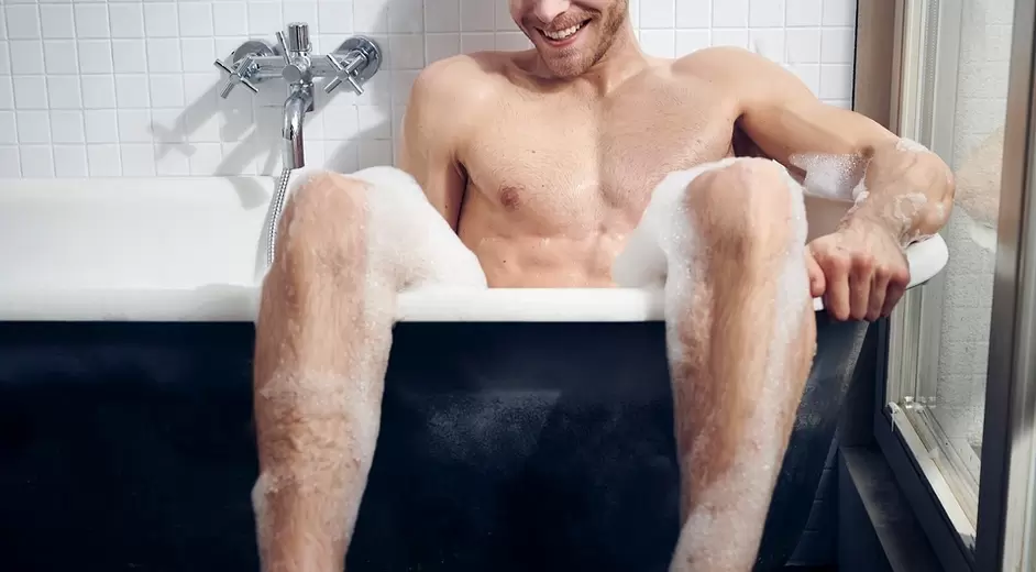 A man takes a bath before stimulating the G-spot